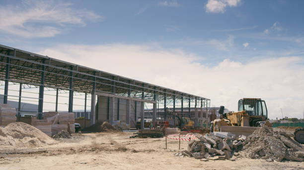 istock Construction site, infrastructure and building industry with architecture, material and industrial vehicle outdoor. Renovation, maintenance and urban development with property and contractor project 2162218537