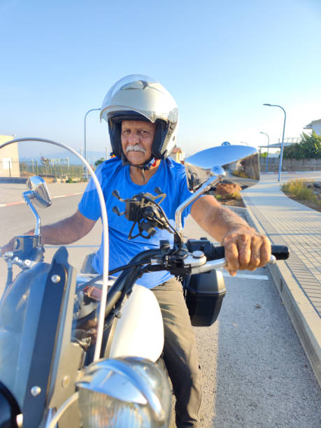 Motorcyclist in protection on a motorcycle close-up