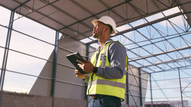 istock Man, construction and tablet at site for project management, building logistics or app. Male person and engineering worker on digital technology at industrial architecture design 2162218597