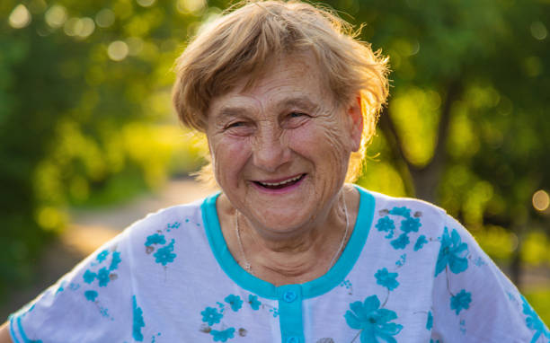 istock Old woman in the garden. Selective focus. 2162219484
