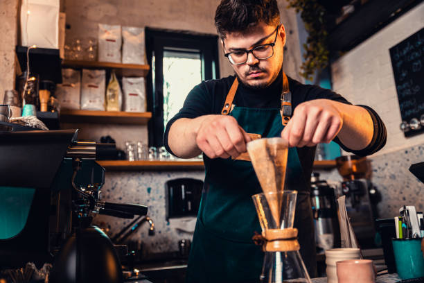 istock Barista preparing filter coffee in a modern coffee shop. 2162221079