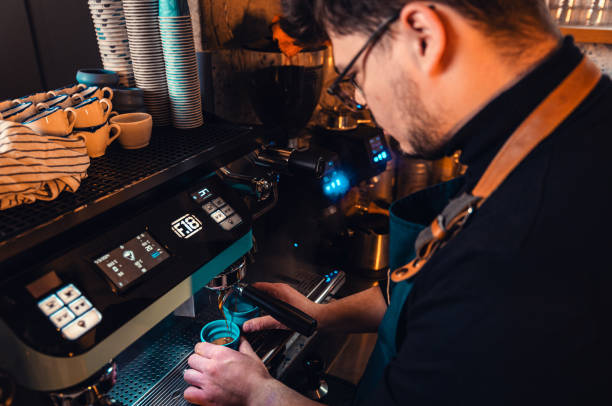istock Barista working behind the counter in the cafe, getting ready to make coffee. 2162221116