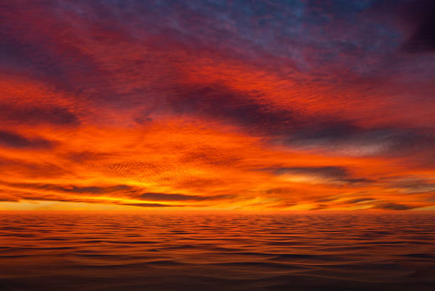 istock Red Sunset Through The Cloudscape Above Sea 2162221435