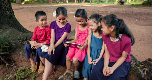 istock Cambodian children using digital tablet in village, Cambodia 2162222682