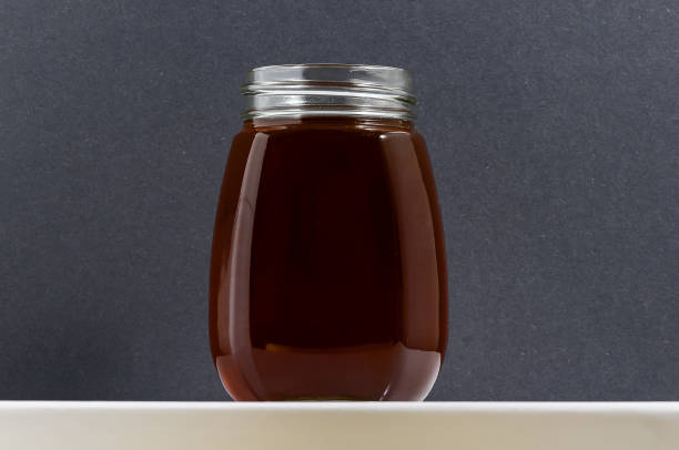istock A jar of brown liquid is sitting on a counter 2162223702