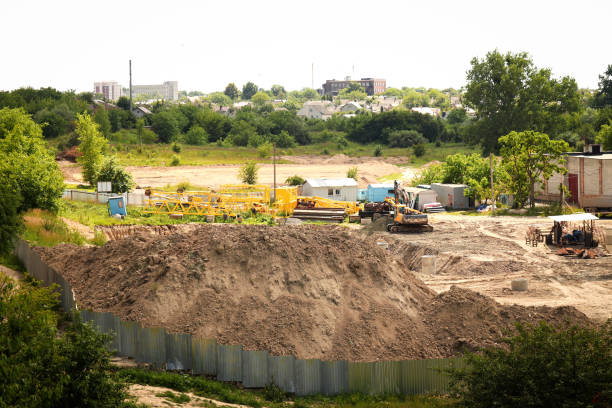 istock Excavator digging soil, showcasing construction and restoration work in Ukraine. Construction site with an excavator digging, emphasizing restoration efforts in Ukraine 2162225256