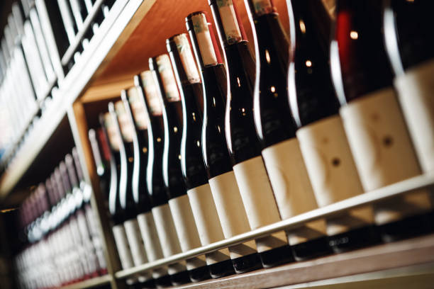 istock Elite Wine Bottles Lined Up on Shelf in Close-Up View, Focus on Foreground 2162226415