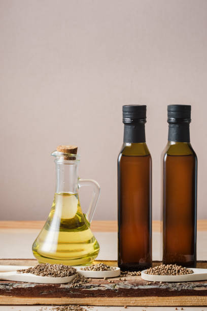 istock Bottles of seed oils and coriander, hemp, cumin seeds. 2162226667