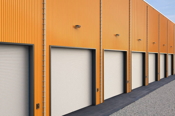 istock Orange warehouse exterior with shutter doors 2162226747
