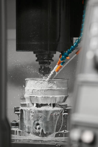 istock Metalworking CNC machine drilling with coolant. Metal machine industry concept. 2162226760