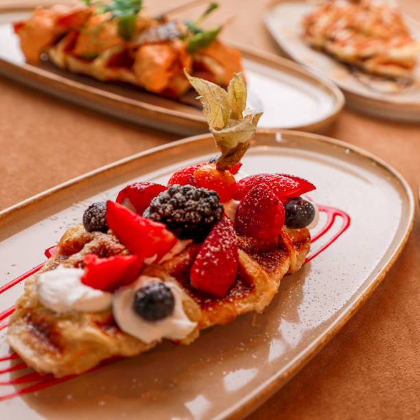 istock waffles with strawberries and berries for breakfast 2162228213