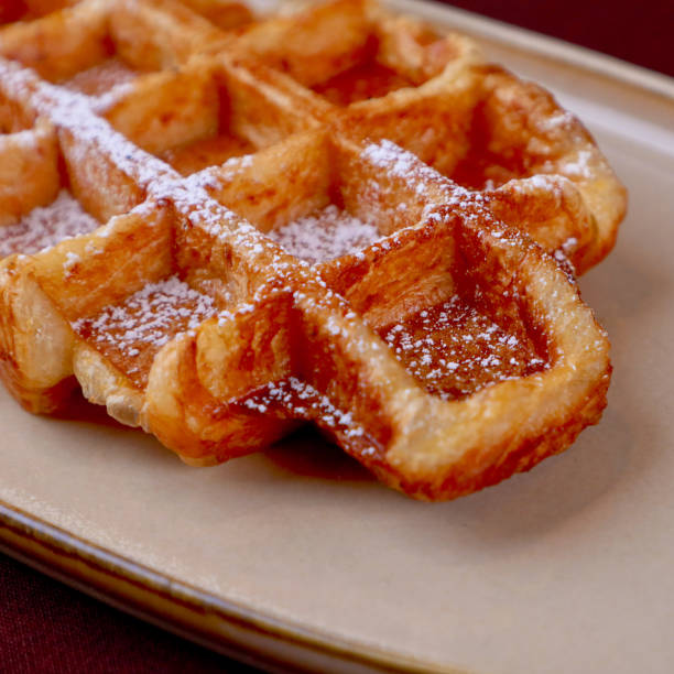 istock Homemade Belgian waffles on white plate 2162228249