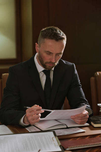 istock Male employee reading business contract 2162228948