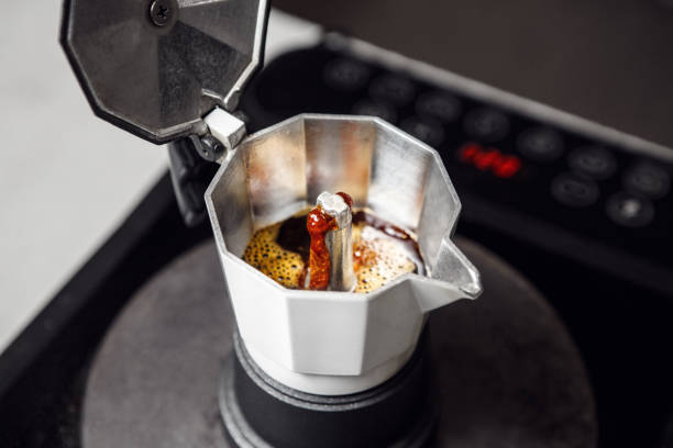 istock Brewing Coffee in Moka Pot on Stove, Showcasing the Boiling Process Up Close 2162229527