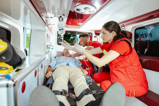 istock Focused medics assisting senior man 2162230445