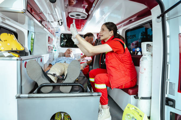 istock Focused medics assisting senior man 2162230695