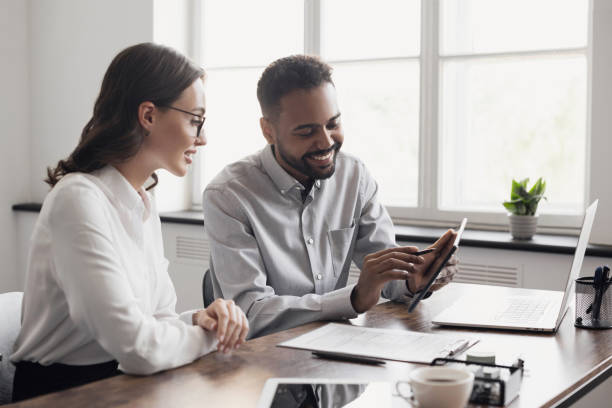 istock Business people working together in office, discussing strategy 2162230820