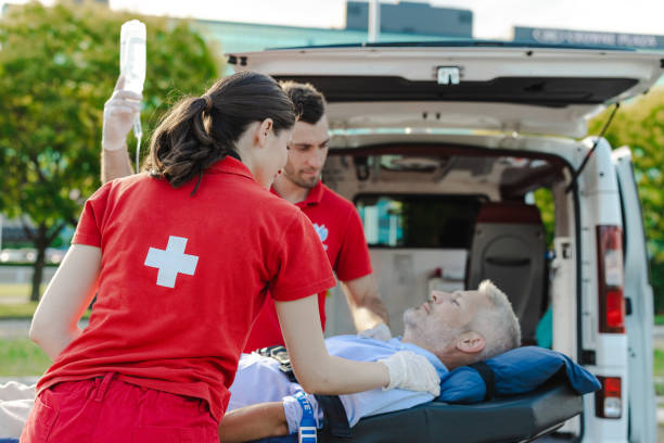 istock Emergency medical technicians assisting injured patient 2162231951