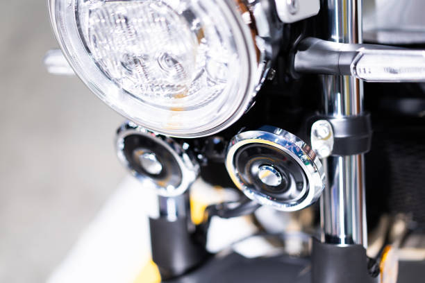 Motorcycle headlights and high performance motorcycle technical parts light blur background.