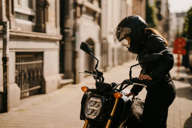 istock Female biker preparing for ride 2162233098