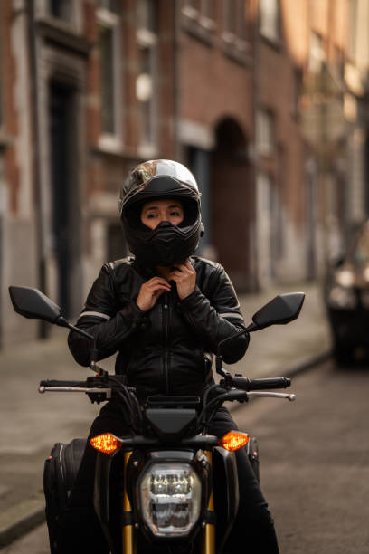 istock Female biker preparing for ride 2162233748