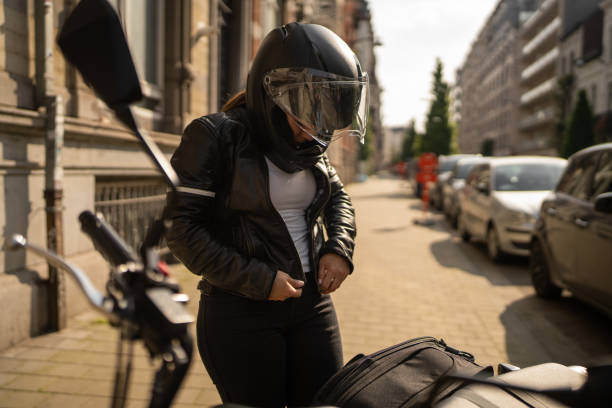 istock Female biker preparing for ride 2162233846