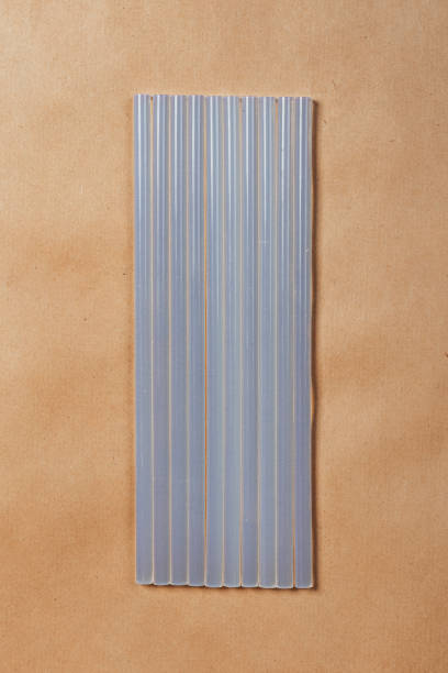 istock hot glue sticks on brown paper background 2162236186