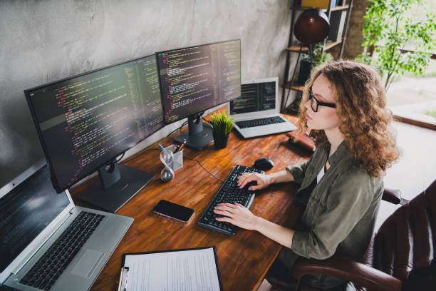 istock Photo of lovely confident successful woman software developer touch keyboard comfortable workspace workstation indoors 2162237658