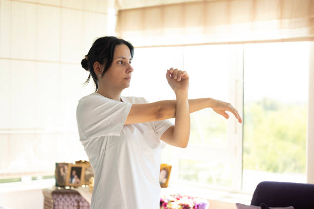 istock woman stretching her arms and hands 2162238598