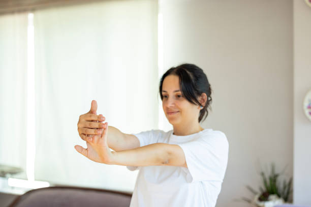 istock woman stretching her arms and hands 2162241134
