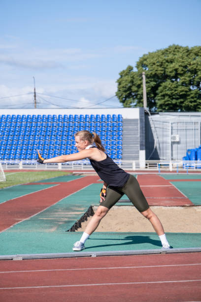 istock young female boxer training in the stadium, warming up 2162241246