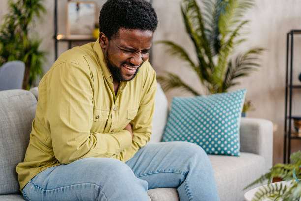 istock Young Man Having Stomachache At Home 2162243023