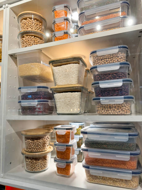 istock Image of kitchen cupboard with storage containers for pasta, beans, lentils, seeds, rice, and chickpeas 2162243070