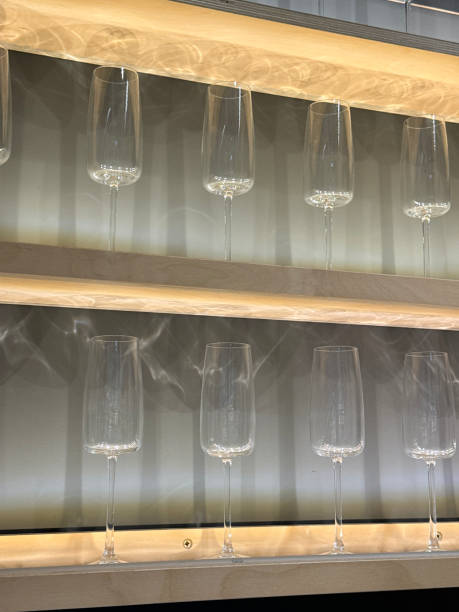 Close up view of crystal stemware glasses on black background.