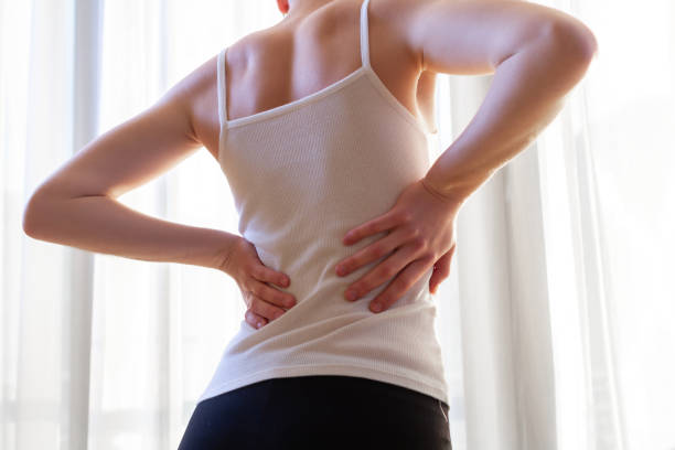 istock Young woman suffering from backache 2162243867