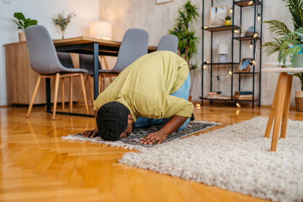 Young Black Muslim Man Praying At Home