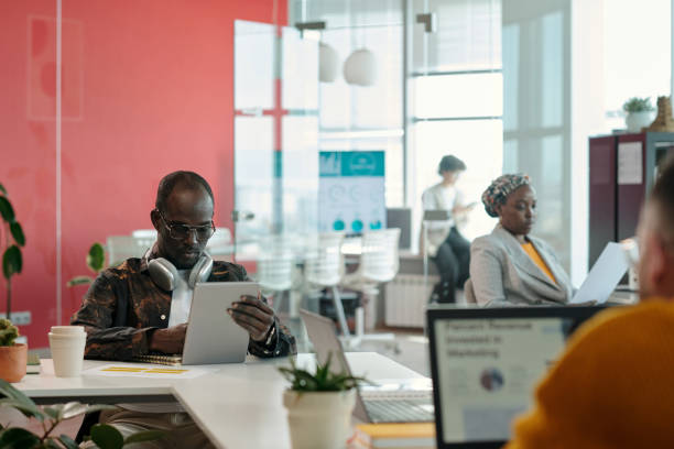istock Professionals Discussing Reports during Office Meeting 2162244189