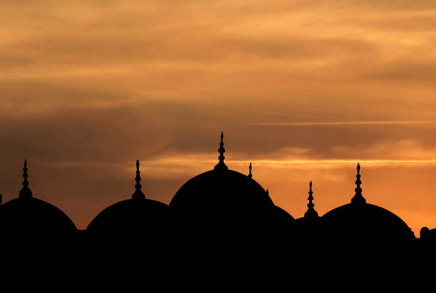 istock Domes of the Valide Sultan Mosque in line when sunset 2162244503