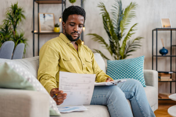 istock Young Man Checking His Finances At Home 2162244807