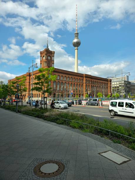 The Rotes Rathaus  is the town hall of Berlin, Germany, located in the Mitte district on Rathausstraße near Alexanderplatz. The image shows the Rathaus and the Berliner Fernsehturm (Communication tower), captured during spring season.