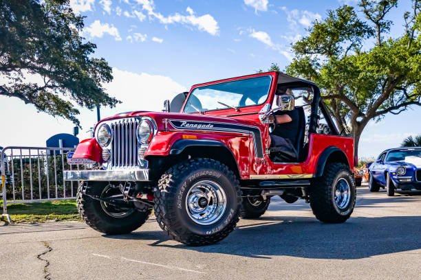 Gulfport, MS - October 02, 2023: Low perspective front corner view of a 1972 Jeep CJ-5 Renegade Soft Top SUV at a local car show.