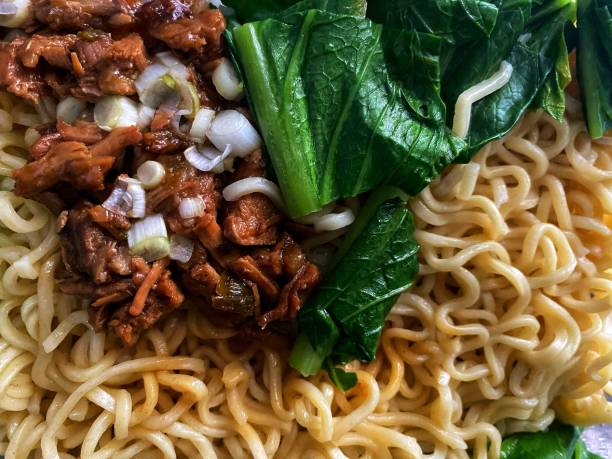 Mie ayam (noodles with chicken, meatballs, dumplings and vegetables) is a popular street food in Indonesia.