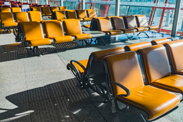 Empty airport departure lounge. Airplanes on the airfield.
