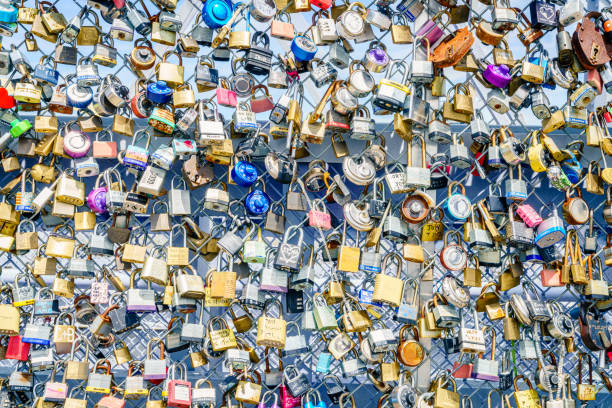 Cincinnati, Ohio, July 30, 2022: Traditional engagement locks on the Purple People Bridge in Cincinnati, Ohio