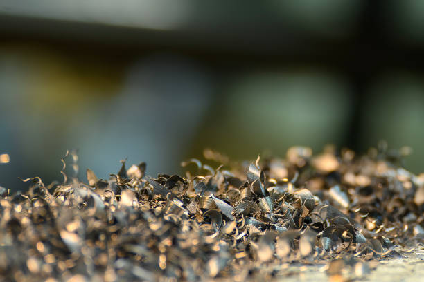 Pile of metal chips in a factory. Metal industry leftovers.