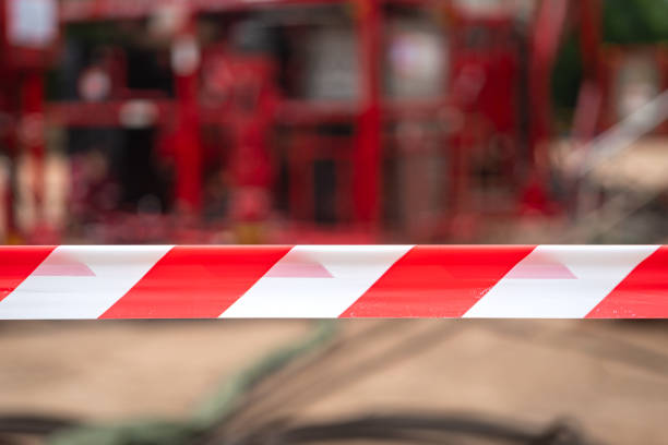 istock Caution barricade tape stiped at industrial work area. 2162273112