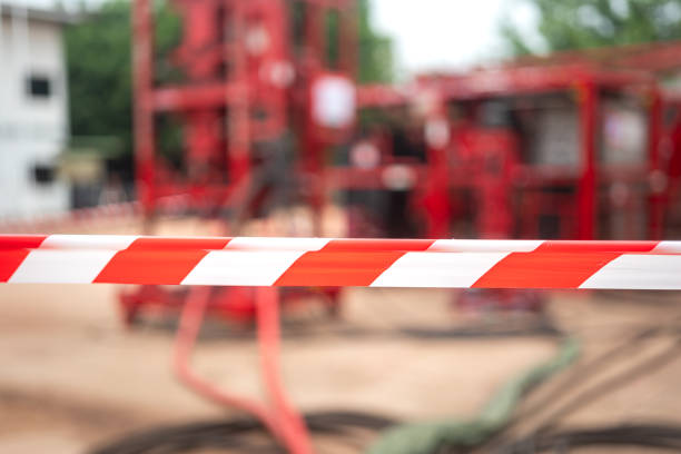 istock Caution barricade tape stiped at industrial work area. 2162273142