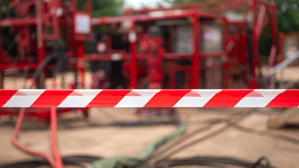 istock Caution barricade tape stiped at industrial work area. 2162273201