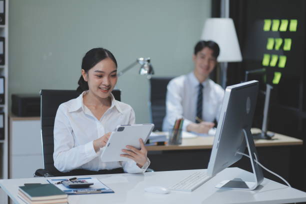 istock Modern Office Businessman Working on Computer. Portrait of Successful Latin IT Software Engineer Working on a Laptop at his Desk. Diverse Workplace with Professionals. Front View Shot 2162274022