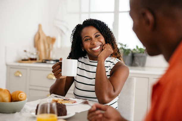 istock Happy couple enjoying a sunny breakfast in a cozy kitchen 2162274238